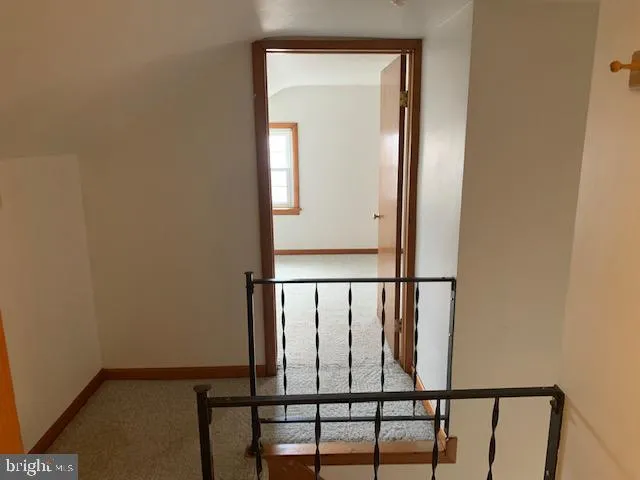 a view of staircase with wooden floor
