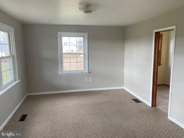 an empty room with windows