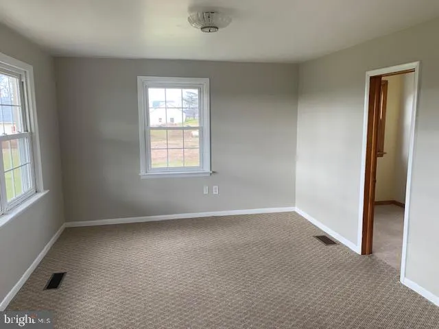 an empty room with windows