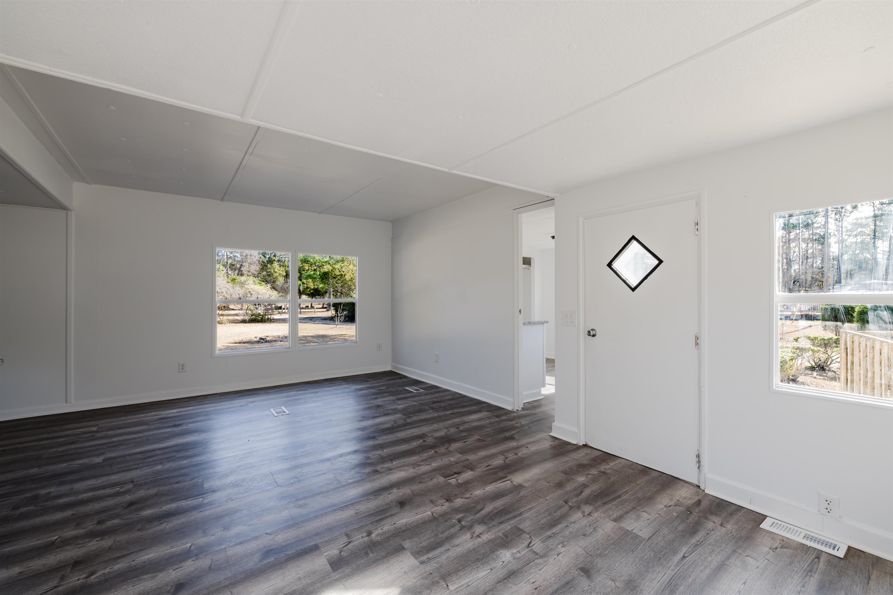 1805 Cactus Drive Loris, SC 29569 - Photo 14 of 31 Entrance foyer with dark wood-style floors and baseboards