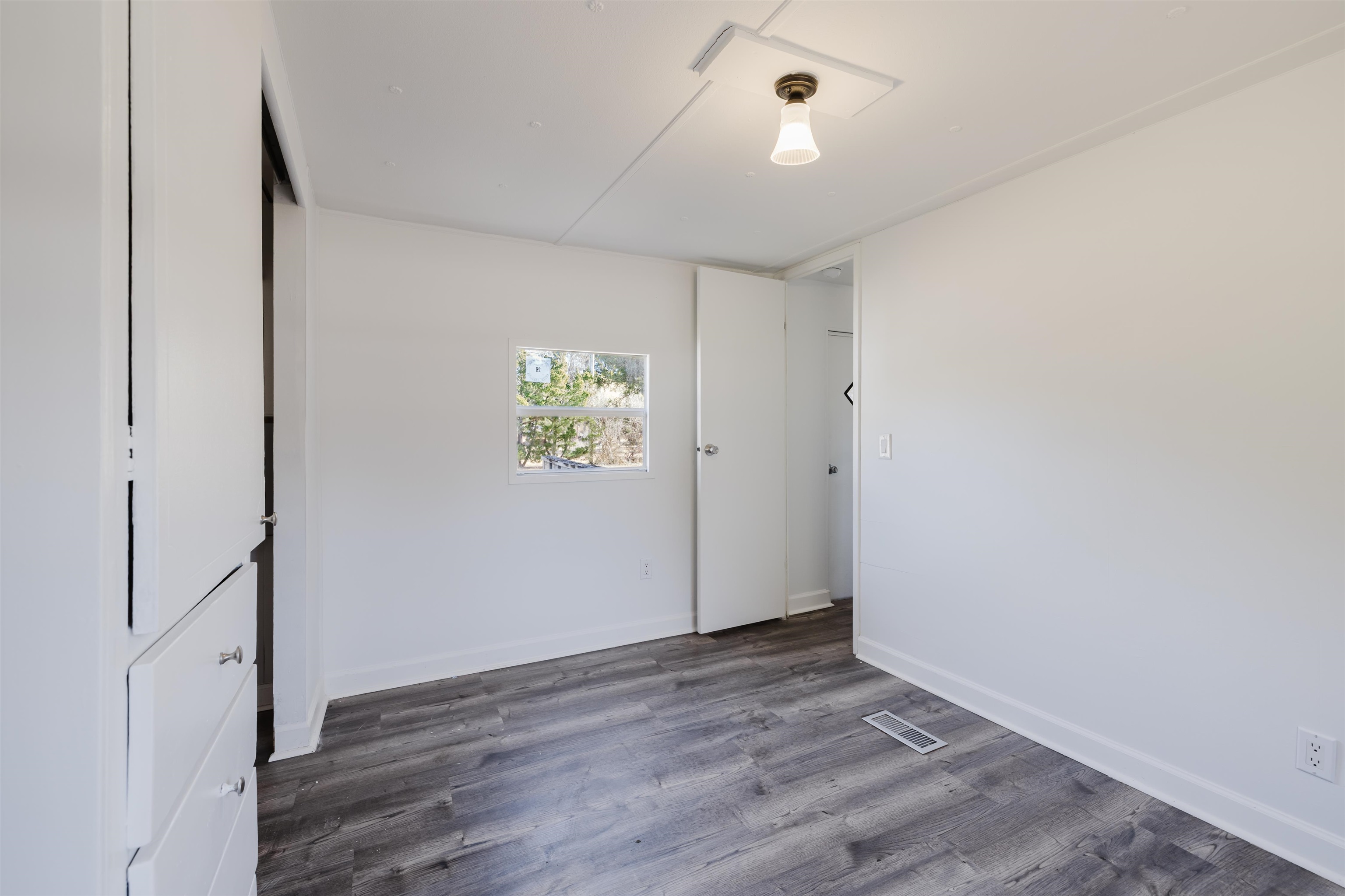 1805 Cactus Drive Loris, SC 29569 - Photo 18 of 31 Unfurnished bedroom with wood finished floors and baseboards