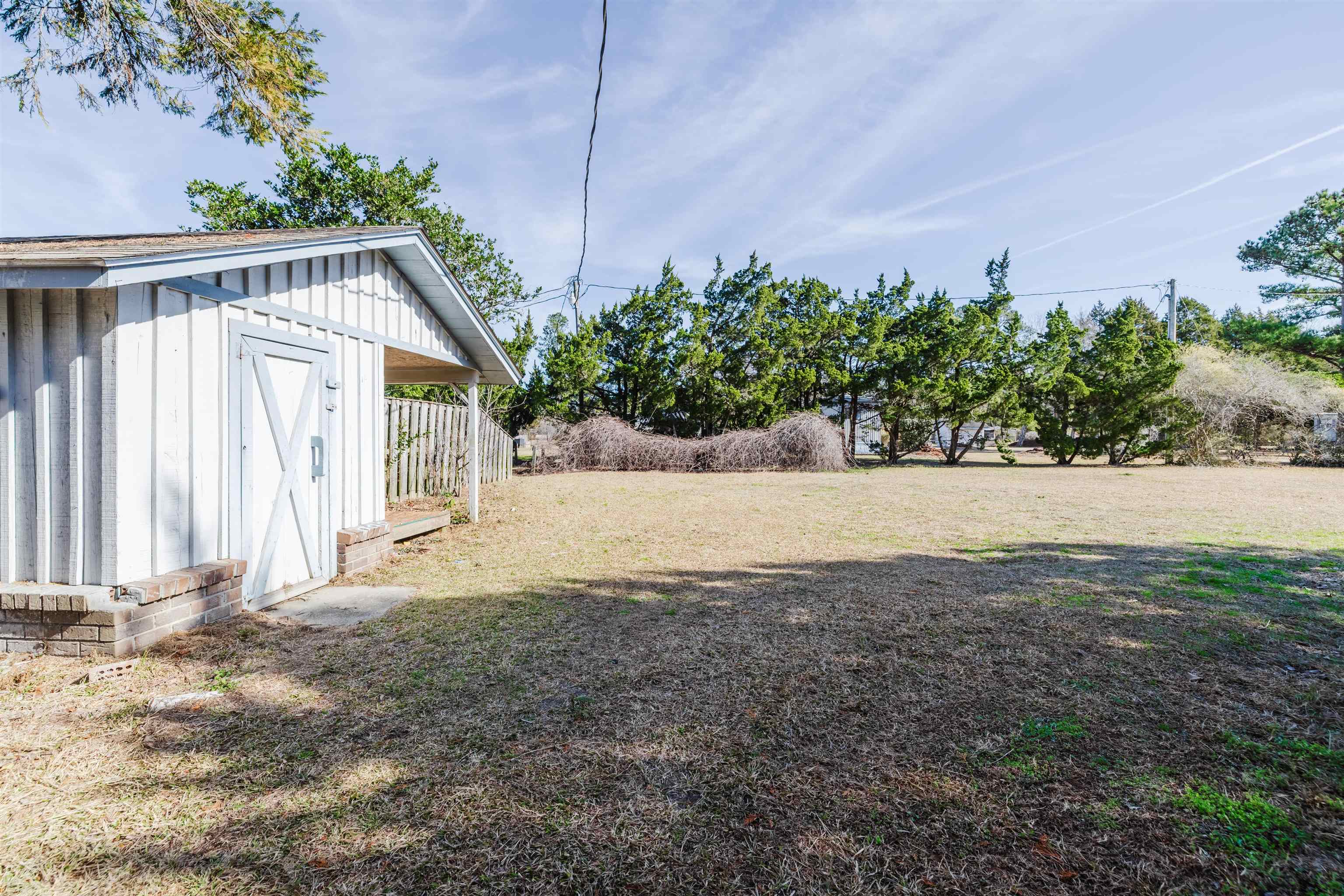 1805 Cactus Drive Loris, SC 29569 - Photo 3 of 31 View of green lawn with a storage shed