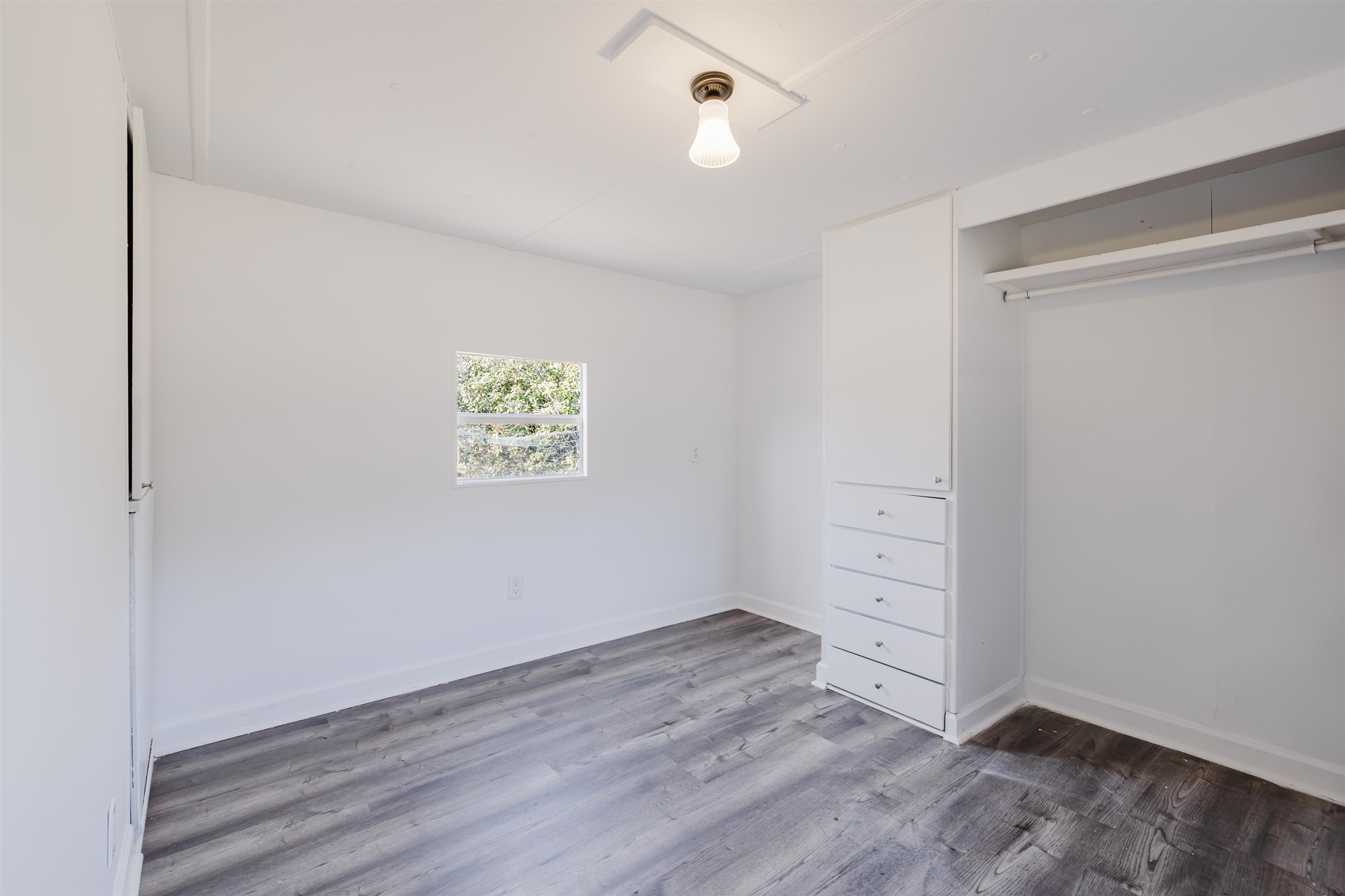1805 Cactus Drive Loris, SC 29569 - Photo 4 of 31 Unfurnished bedroom featuring dark wood-type flooring and a closet