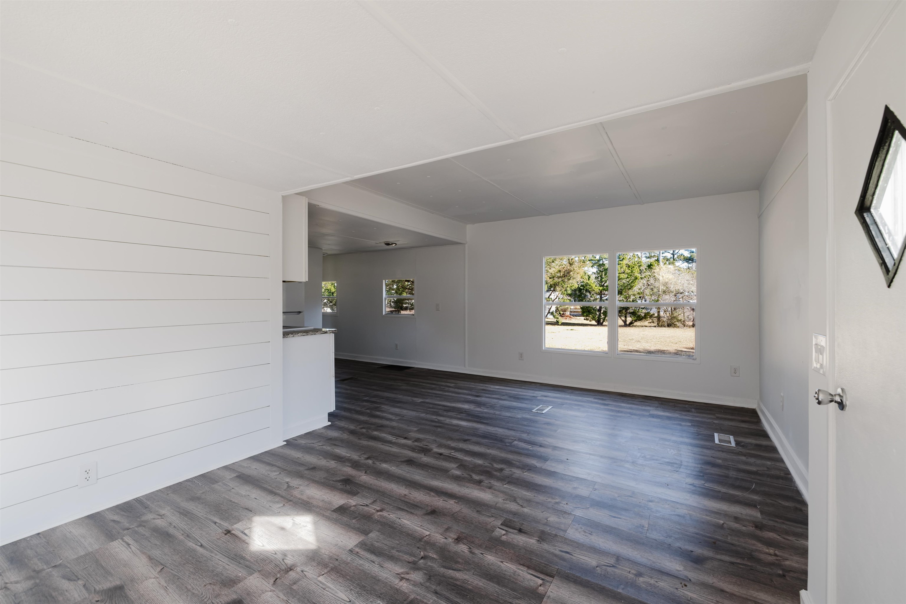 1805 Cactus Drive Loris, SC 29569 - Photo 6 of 31 Unfurnished living room featuring dark wood-style flooring