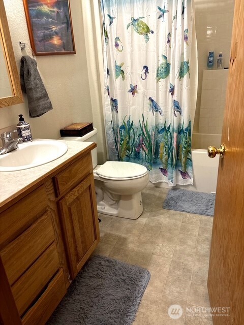 1579 Pine Creek Road, Unit A Tonasket, WA 98855 - Photo 11 of 24 a bathroom with a sink a toilet and shower