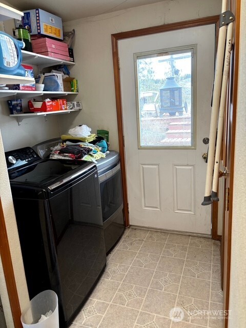 1579 Pine Creek Road, Unit A Tonasket, WA 98855 - Photo 12 of 24 a kitchen with stainless steel appliances a stove and a refrigerator
