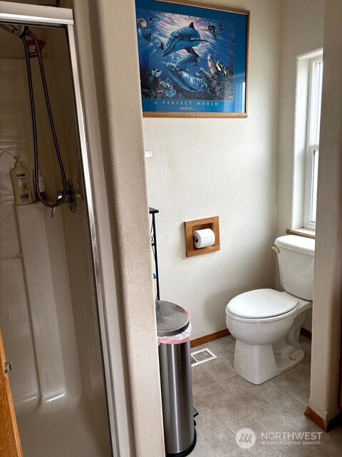 1579 Pine Creek Road, Unit A Tonasket, WA 98855 - Photo 14 of 24 a white toilet sitting next to a sink