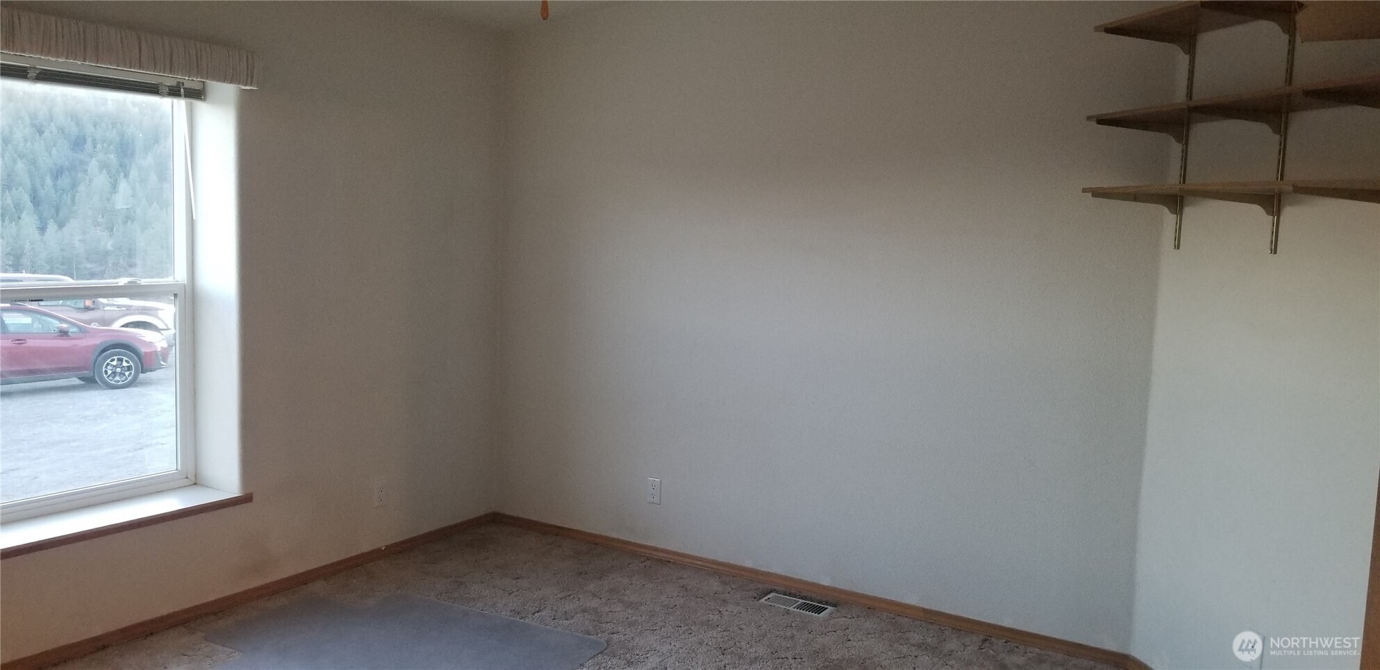1579 Pine Creek Road, Unit A Tonasket, WA 98855 - Photo 17 of 24 an empty room with a window