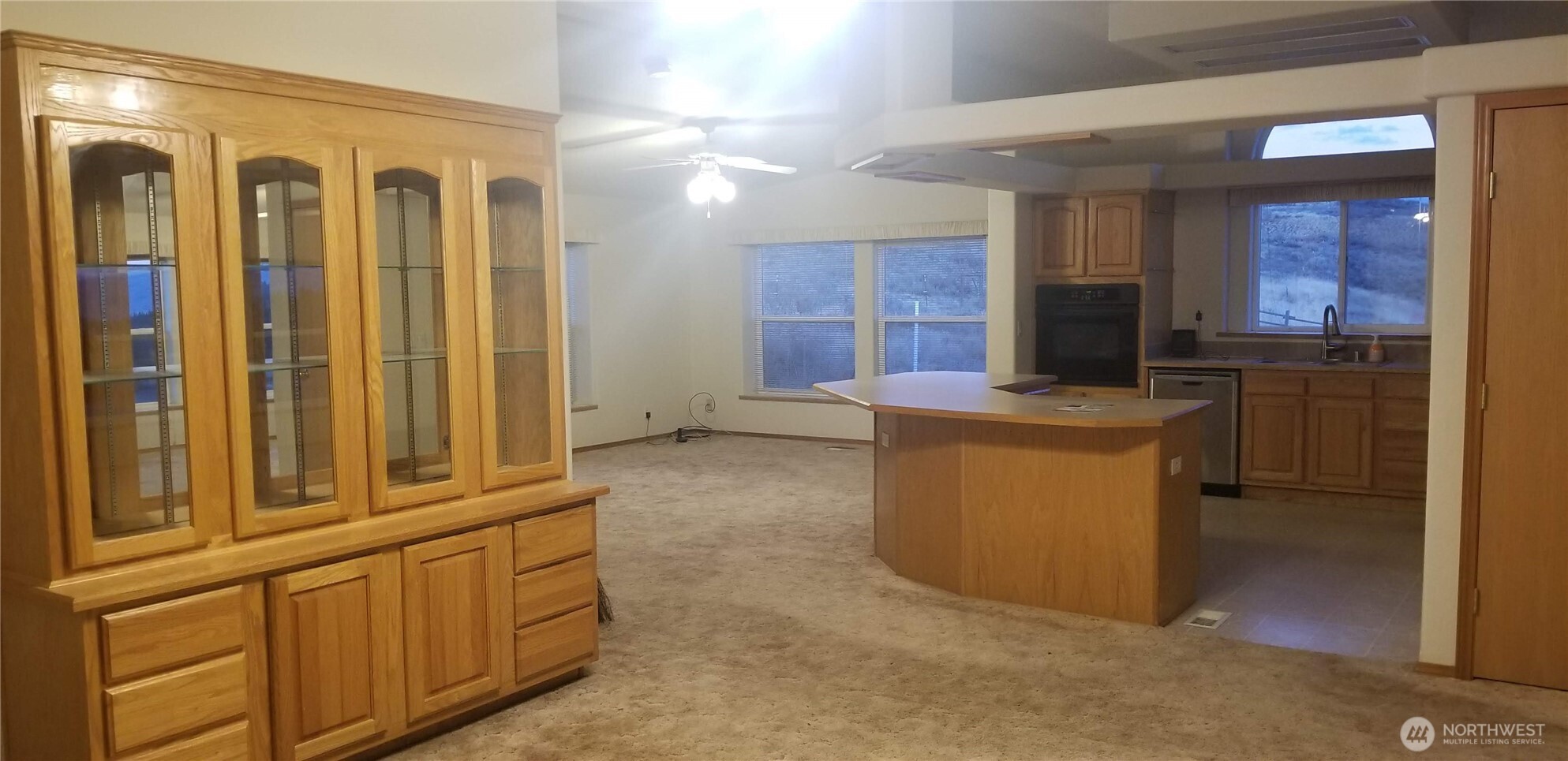 1579 Pine Creek Road, Unit A Tonasket, WA 98855 - Photo 19 of 24 a view of a hallway with washer and dryer