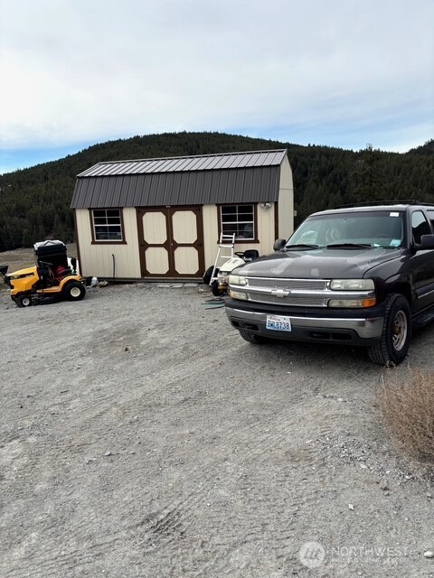 1579 Pine Creek Road, Unit A Tonasket, WA 98855 - Photo 6 of 24 a view of a car in garage