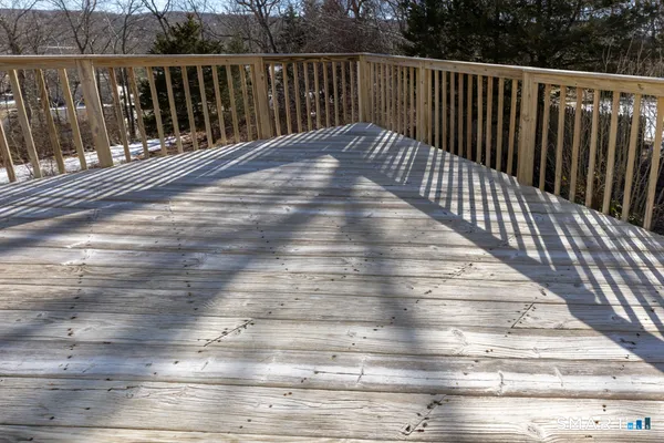a view of balcony with wooden floor