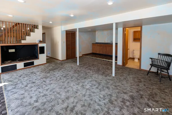 a view of work space with furniture and windows