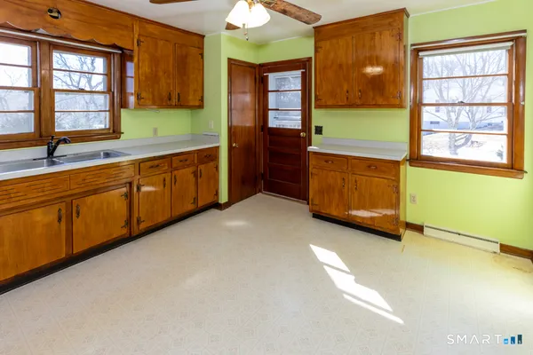 a kitchen with sink and window