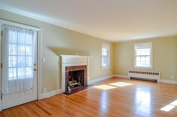 77 West Central Street Natick, MA 01760 - Photo 13 of 22 an empty room with windows and fireplace