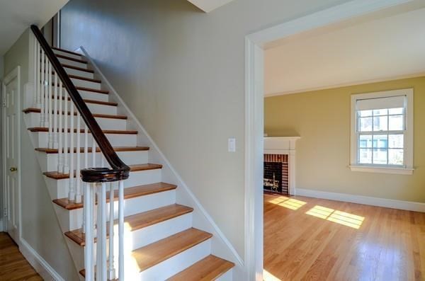 77 West Central Street Natick, MA 01760 - Photo 15 of 22 wooden floor in an empty room with a fireplace