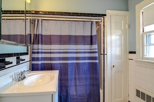 77 West Central Street Natick, MA 01760 - Photo 18 of 22 a bathroom with a sink and a mirror