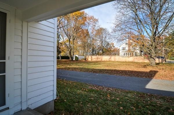 77 West Central Street Natick, MA 01760 - Photo 3 of 22 a view of door of the house and yard