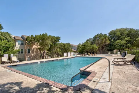 a view of swimming pool with seating space