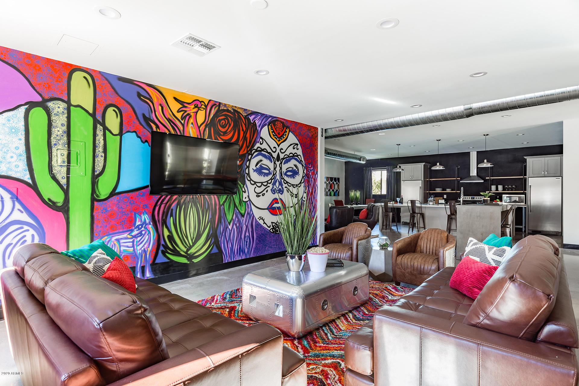 7505 East Main Street, Unit A Scottsdale, AZ 85251 - Photo 1 of 30 a room with lots of white furniture and rug