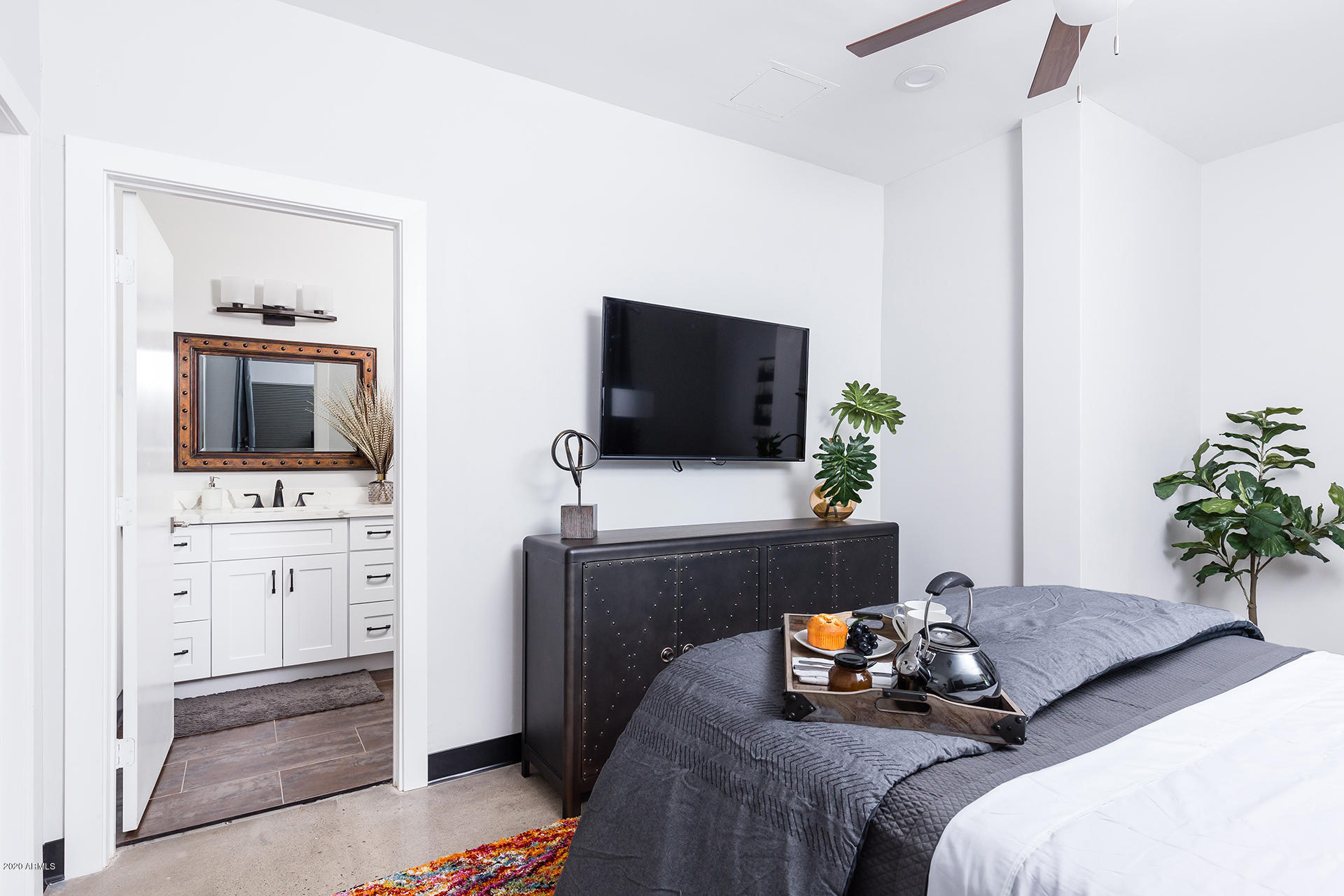 7505 East Main Street, Unit A Scottsdale, AZ 85251 - Photo 14 of 30 a bedroom with bed and flat screen tv