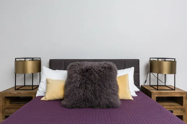 a bedroom with bed and window