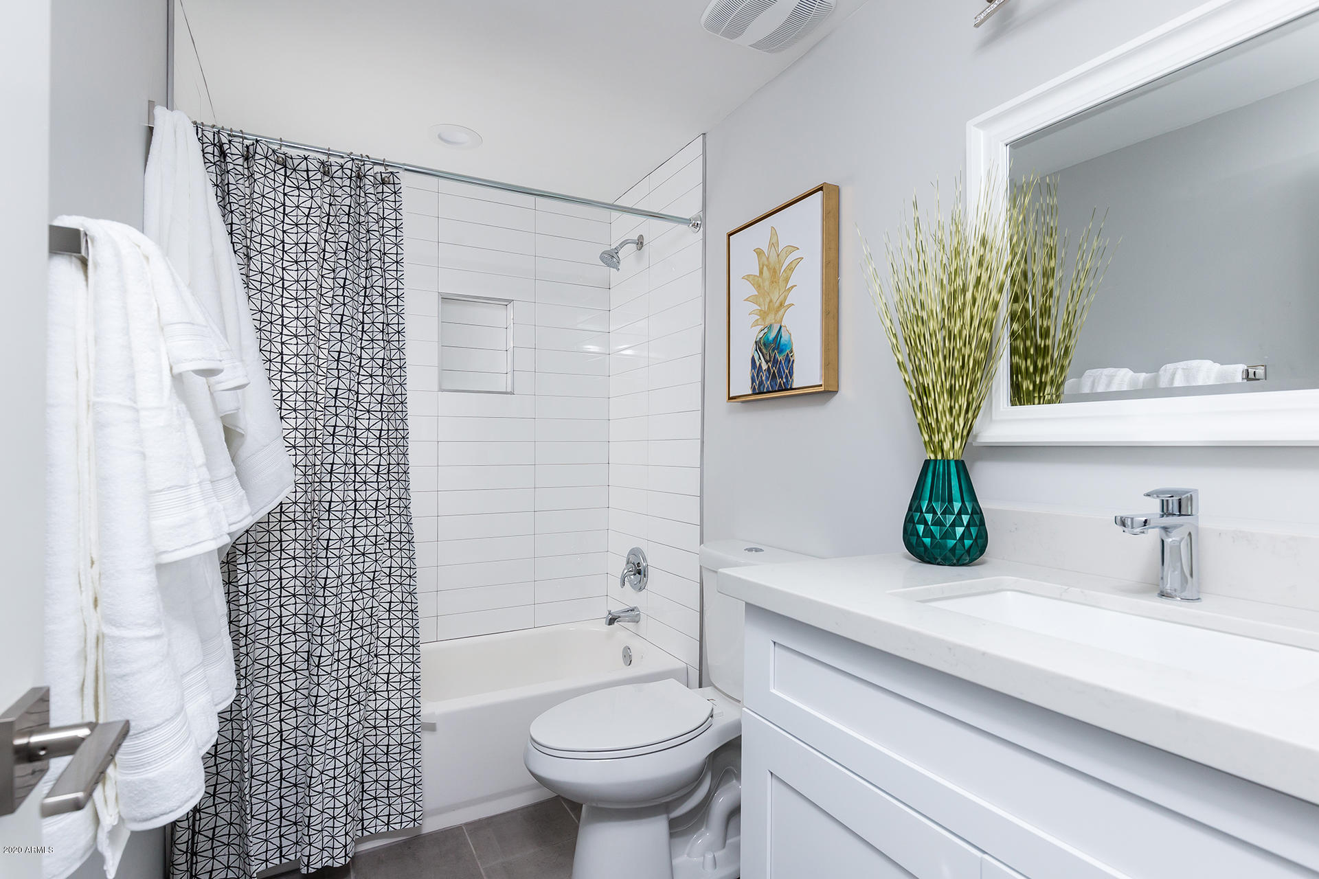 7505 East Main Street, Unit A Scottsdale, AZ 85251 - Photo 19 of 30 a bathroom with a sink toilet and shower