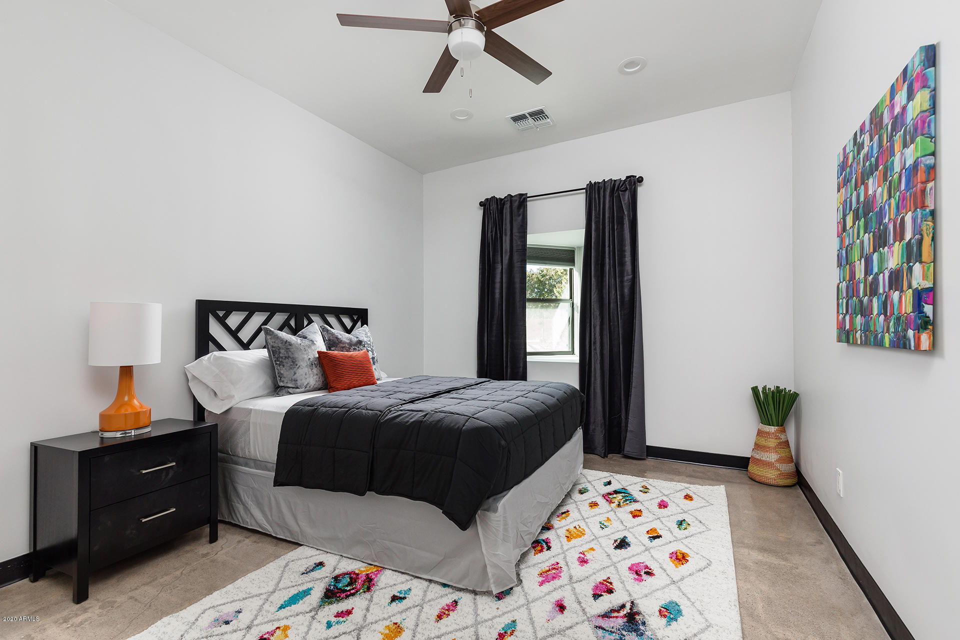 7505 East Main Street, Unit A Scottsdale, AZ 85251 - Photo 24 of 30 a bedroom with a bed and a window