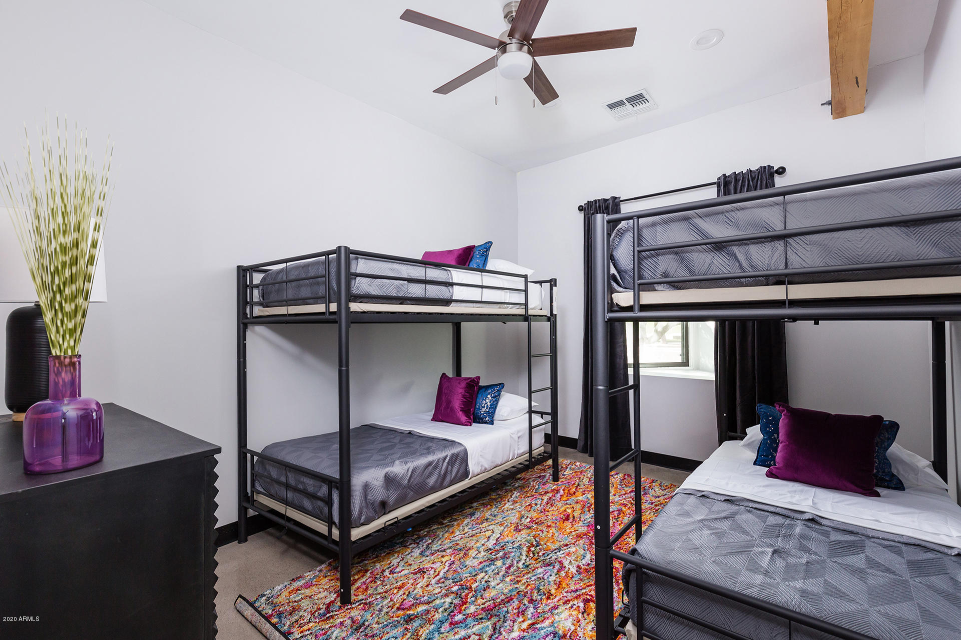 7505 East Main Street, Unit A Scottsdale, AZ 85251 - Photo 25 of 30 a bedroom with a bed and a dresser