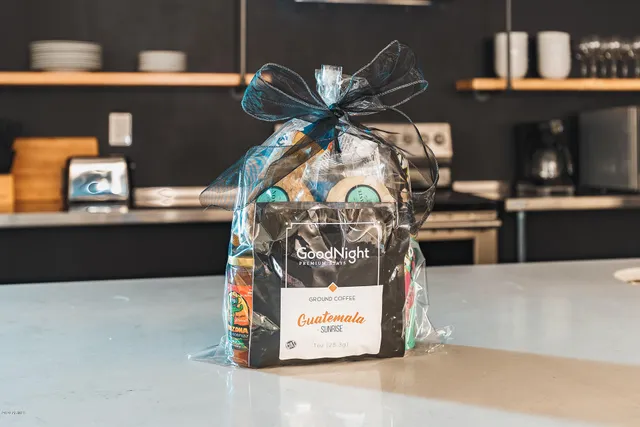 a bedroom with a bed table and a window