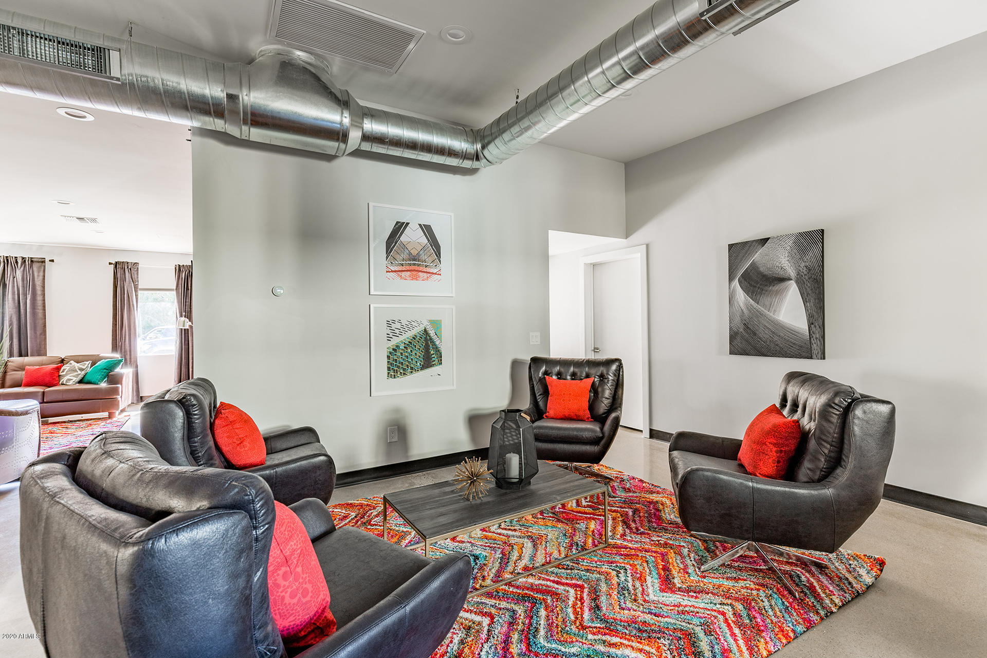 7505 East Main Street, Unit A Scottsdale, AZ 85251 - Photo 5 of 30 a living room with furniture and a couch