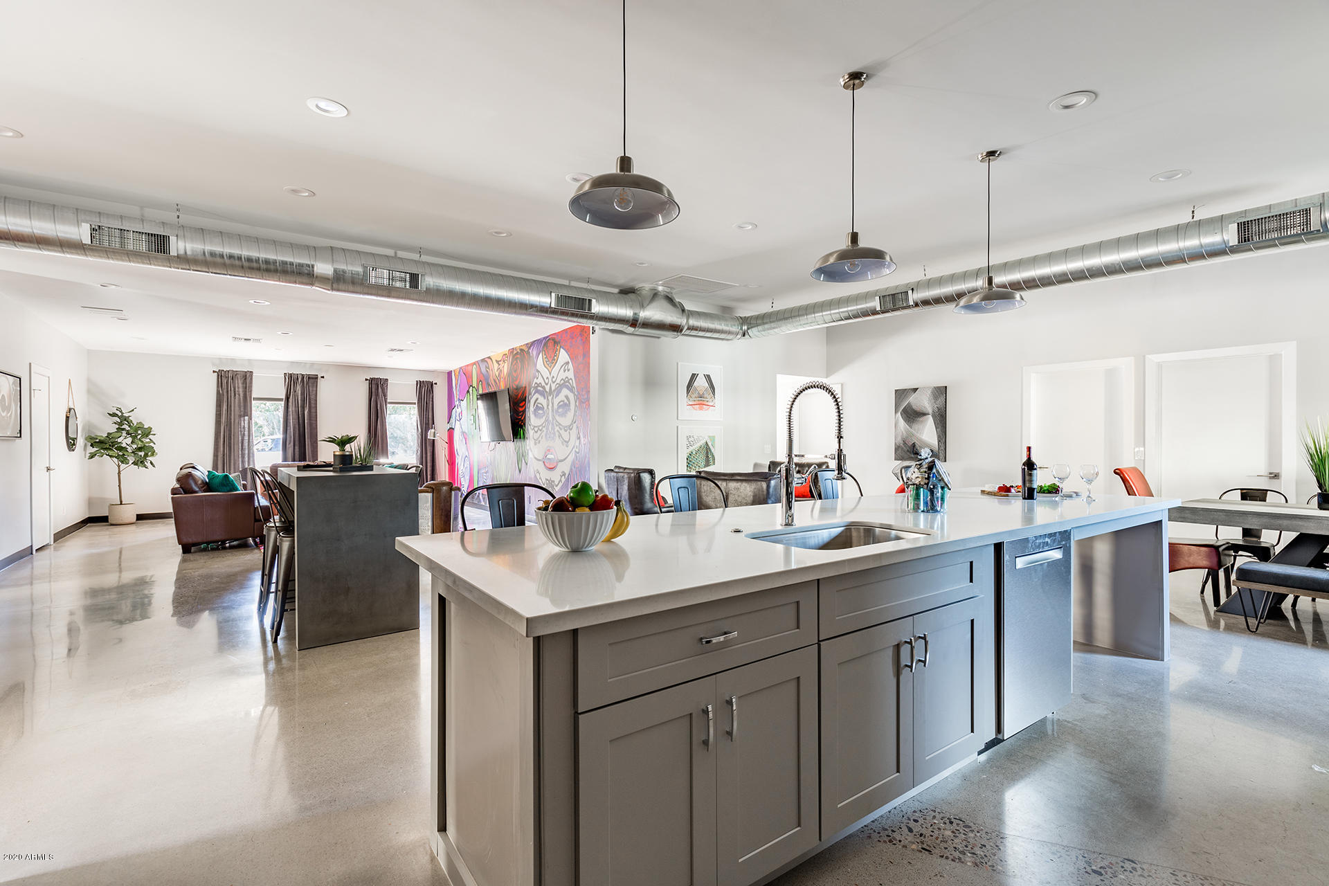 7505 East Main Street, Unit A Scottsdale, AZ 85251 - Photo 30 of 30 a kitchen with lots of counter space a sink and living room view