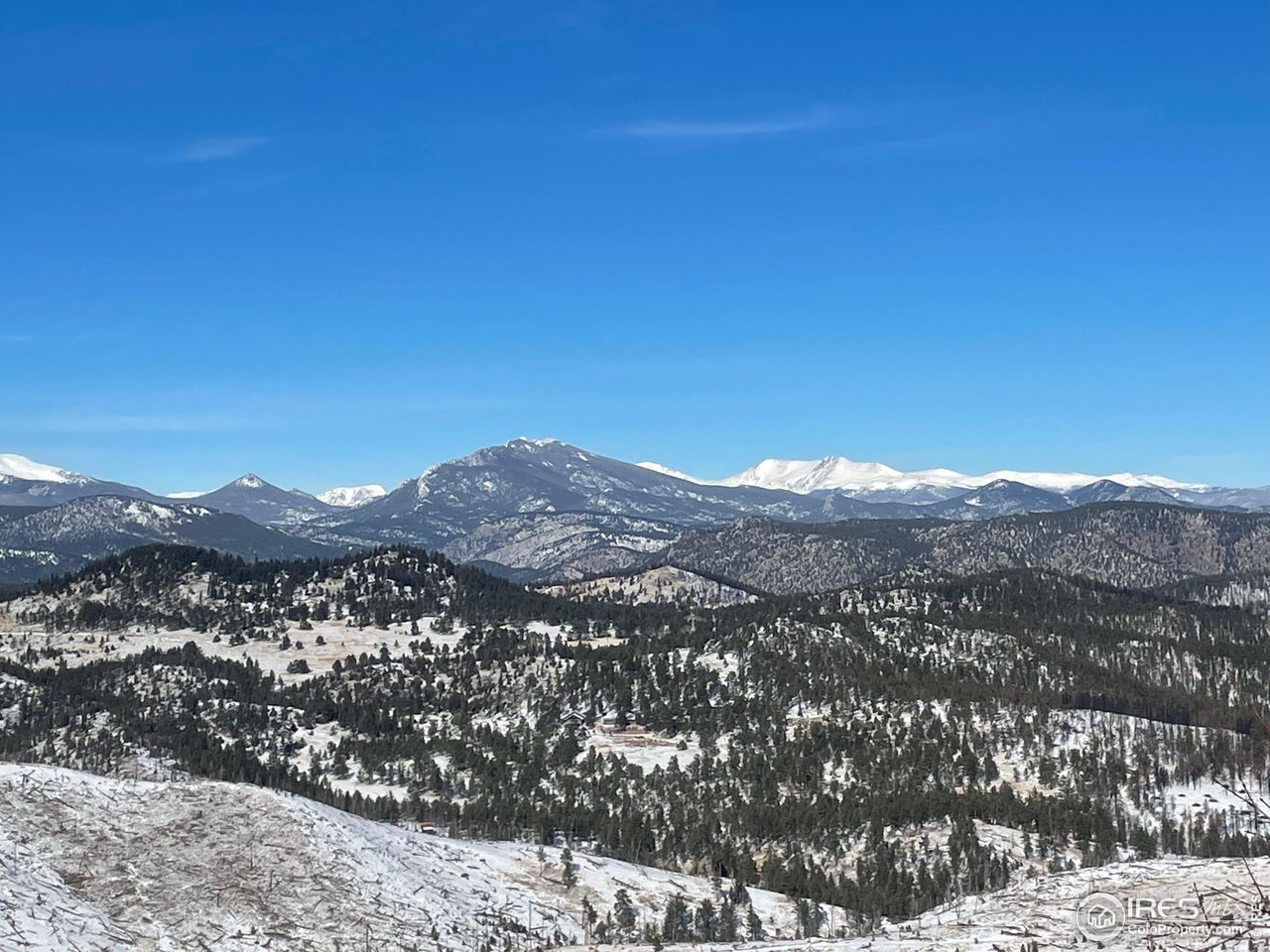 1009 County Road 87J Lyons, CO 80540 - Photo 17 of 29 a view of a mountain range in a cloudy sky