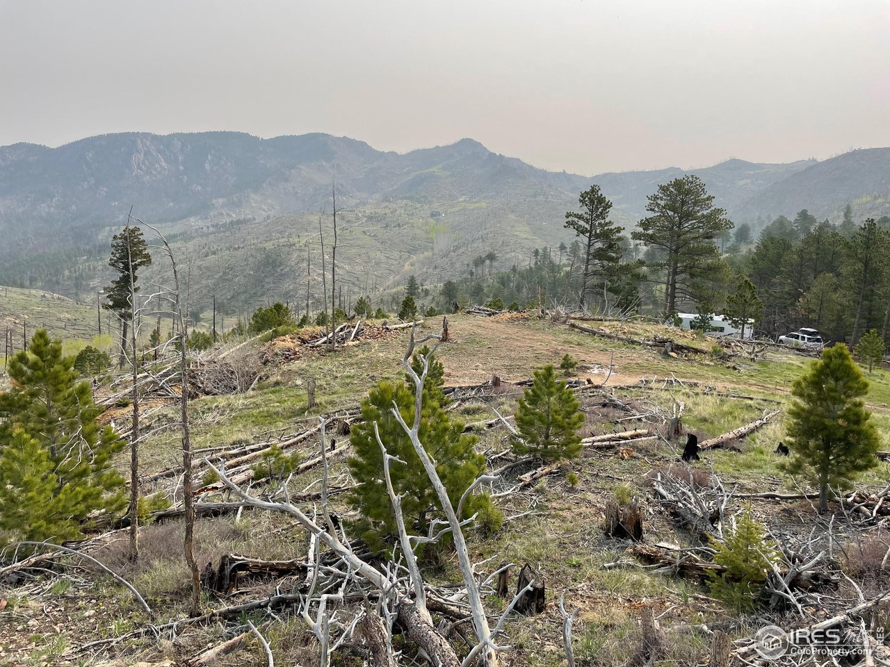 1009 County Road 87J Lyons, CO 80540 - Photo 27 of 29 a view of a town with mountains in the background