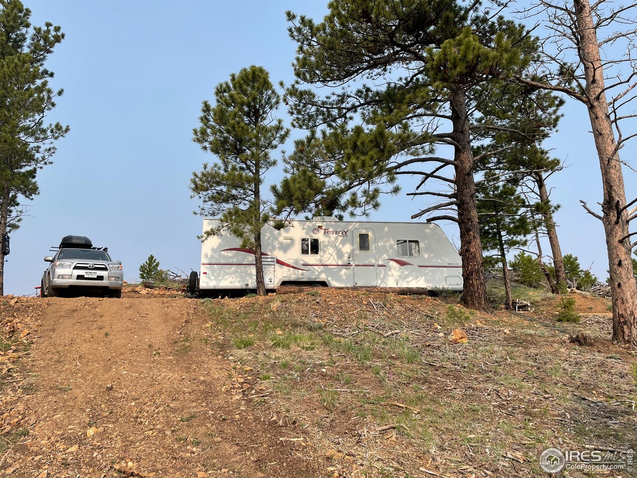 1009 County Road 87J Lyons, CO 80540 - Photo 29 of 29 a front view of a house with a yard