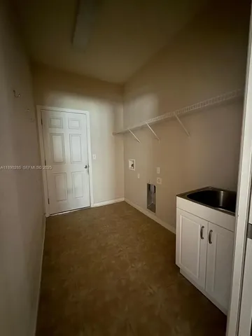 a kitchen with a stove and a refrigerator