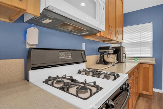 a table with chairs and a stove top oven