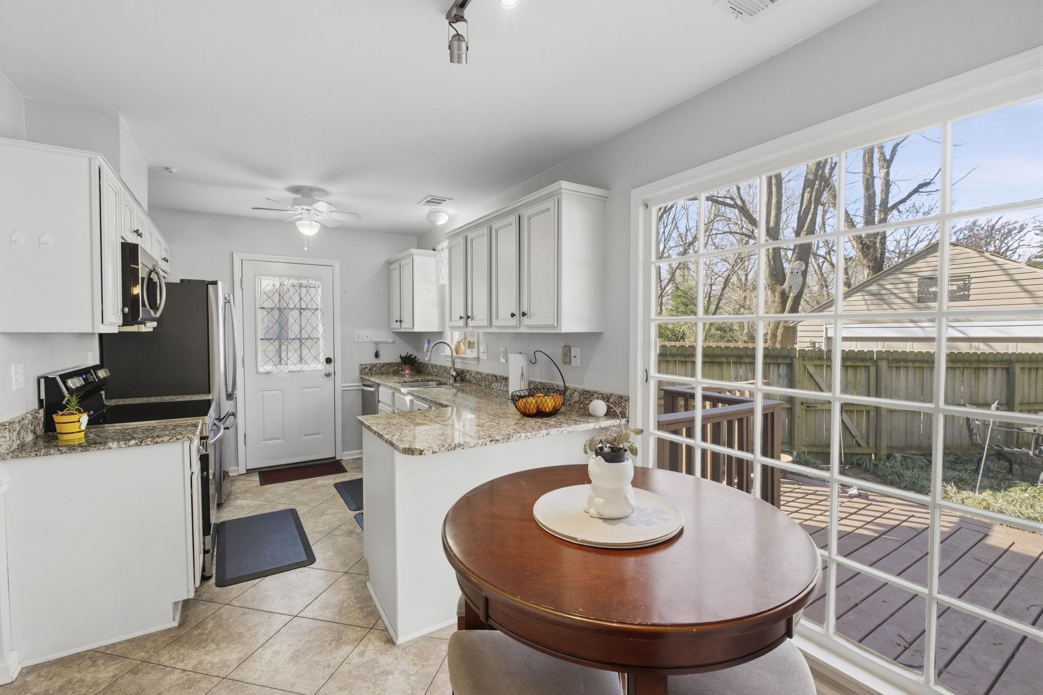 395 Alexander Street Memphis, TN 38111 - Photo 11 of 36 a kitchen with a sink and a stove