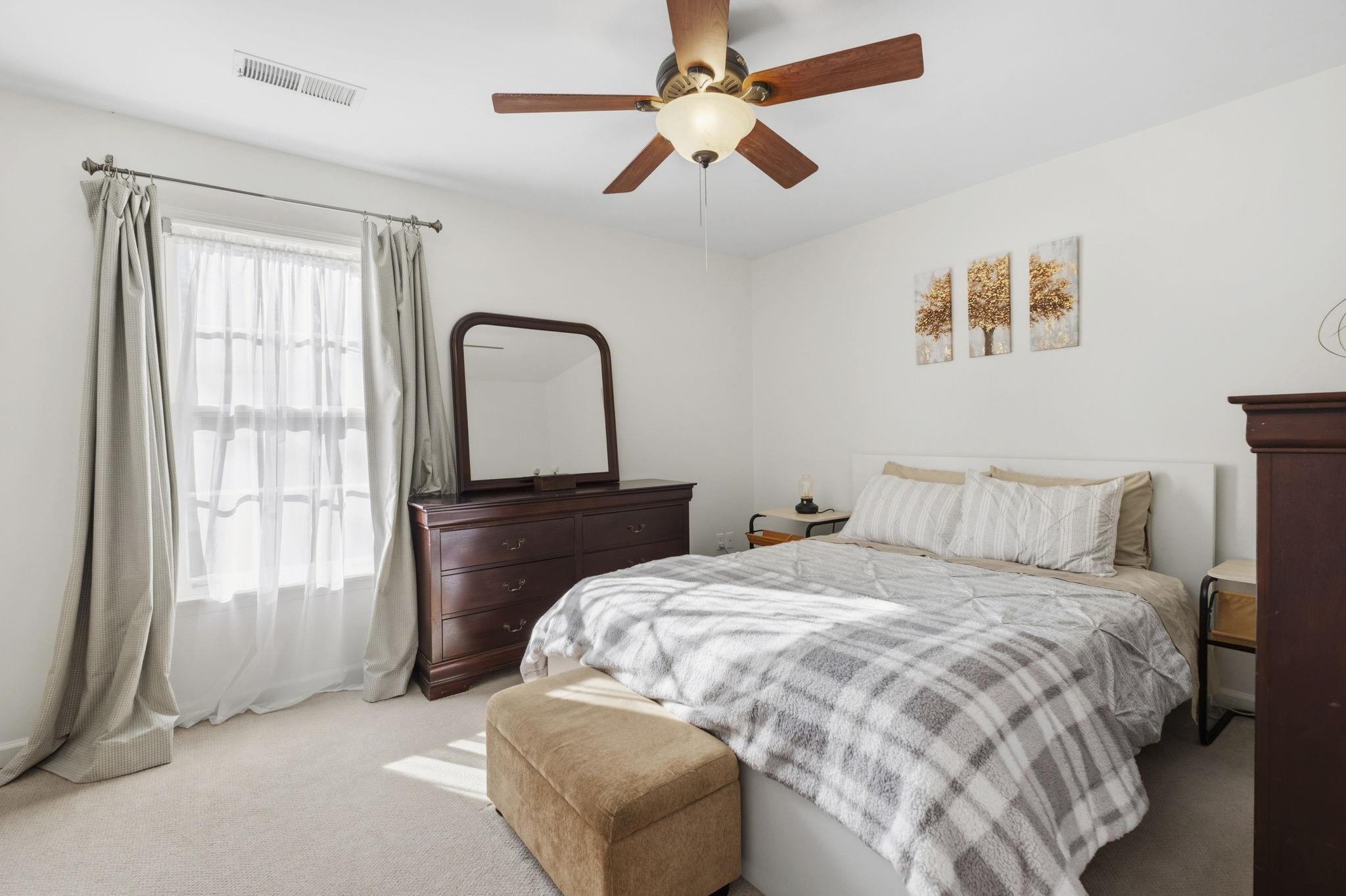 395 Alexander Street Memphis, TN 38111 - Photo 19 of 36 a bedroom with a bed next to a window with a chandelier