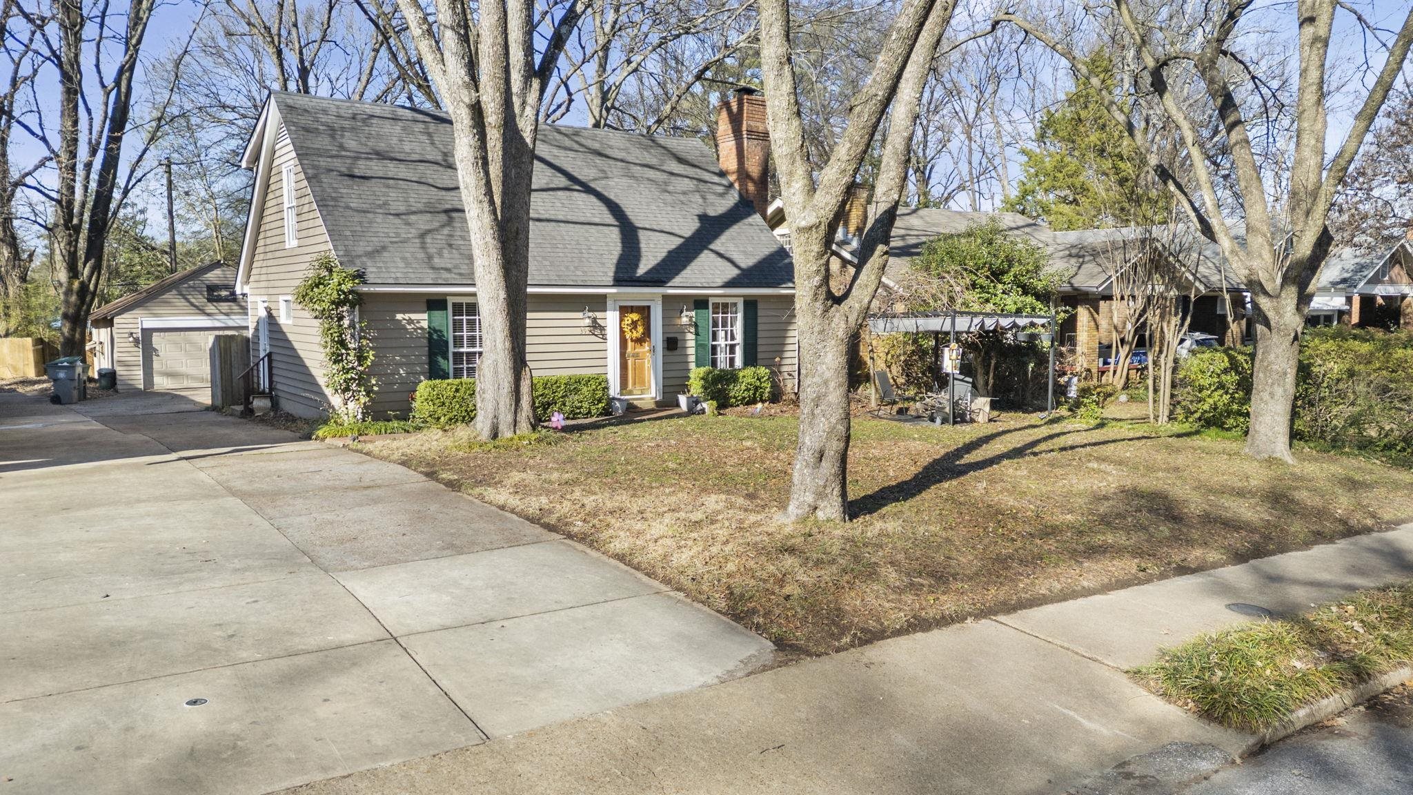 395 Alexander Street Memphis, TN 38111 - Photo 2 of 36 a view of a road with a tree in front of it