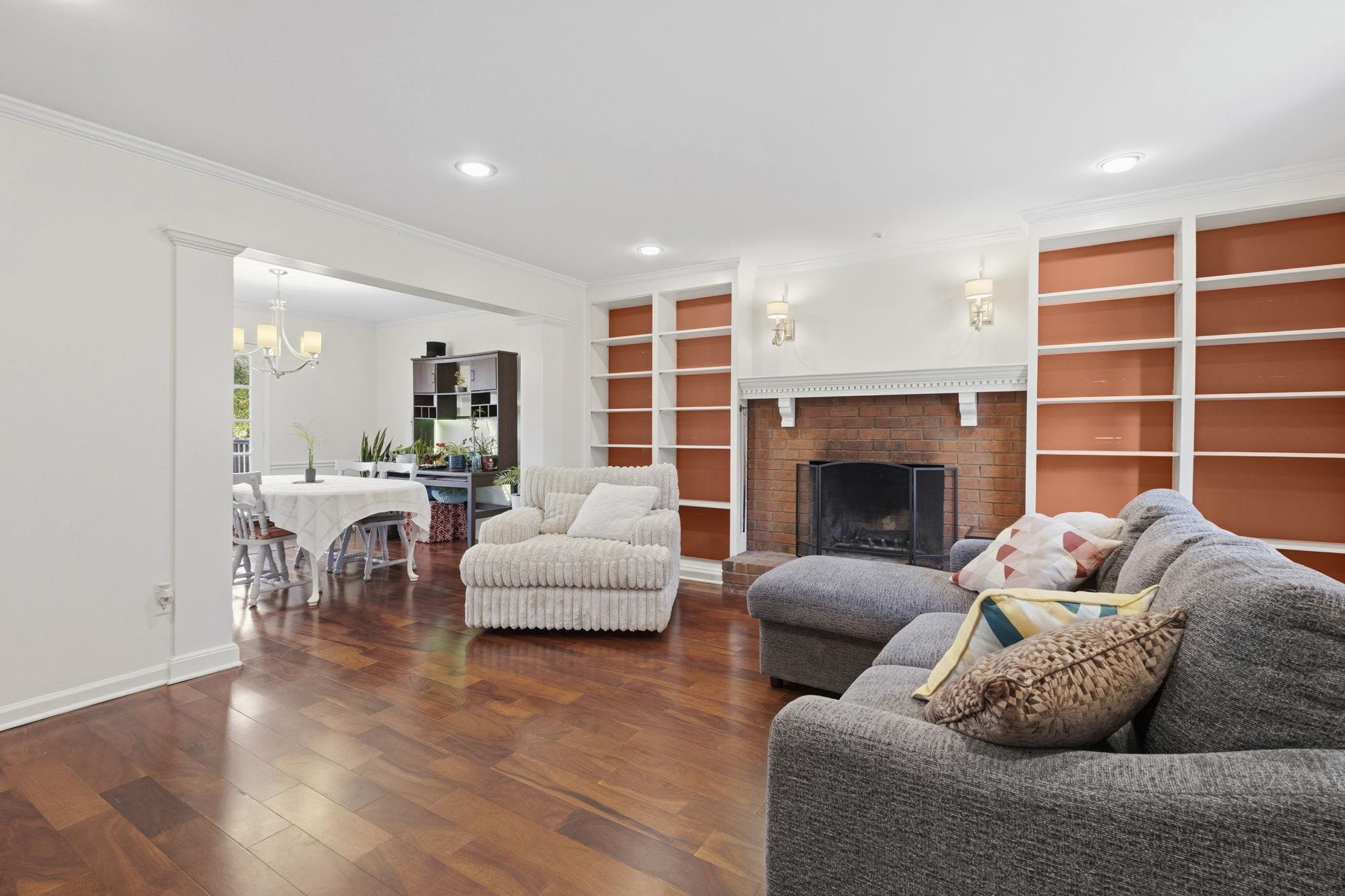 395 Alexander Street Memphis, TN 38111 - Photo 6 of 36 a living room with furniture a fireplace and a large window