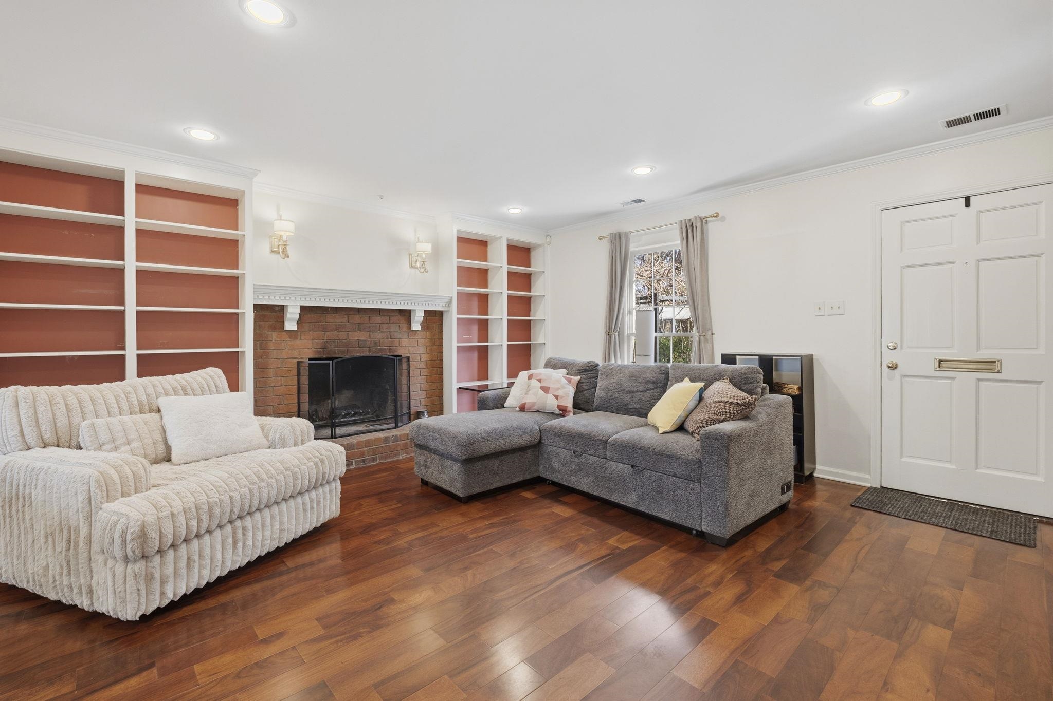 395 Alexander Street Memphis, TN 38111 - Photo 7 of 36 a living room with furniture window and a fireplace