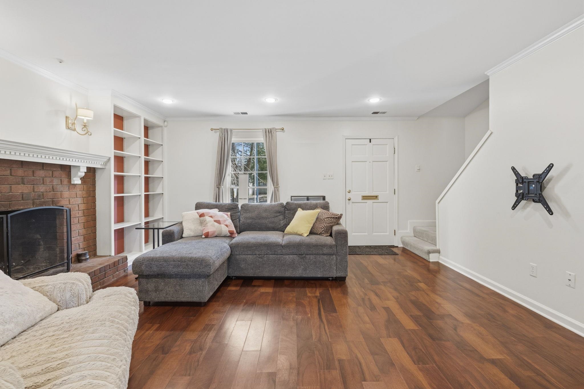 395 Alexander Street Memphis, TN 38111 - Photo 8 of 36 a living room with furniture and a fireplace