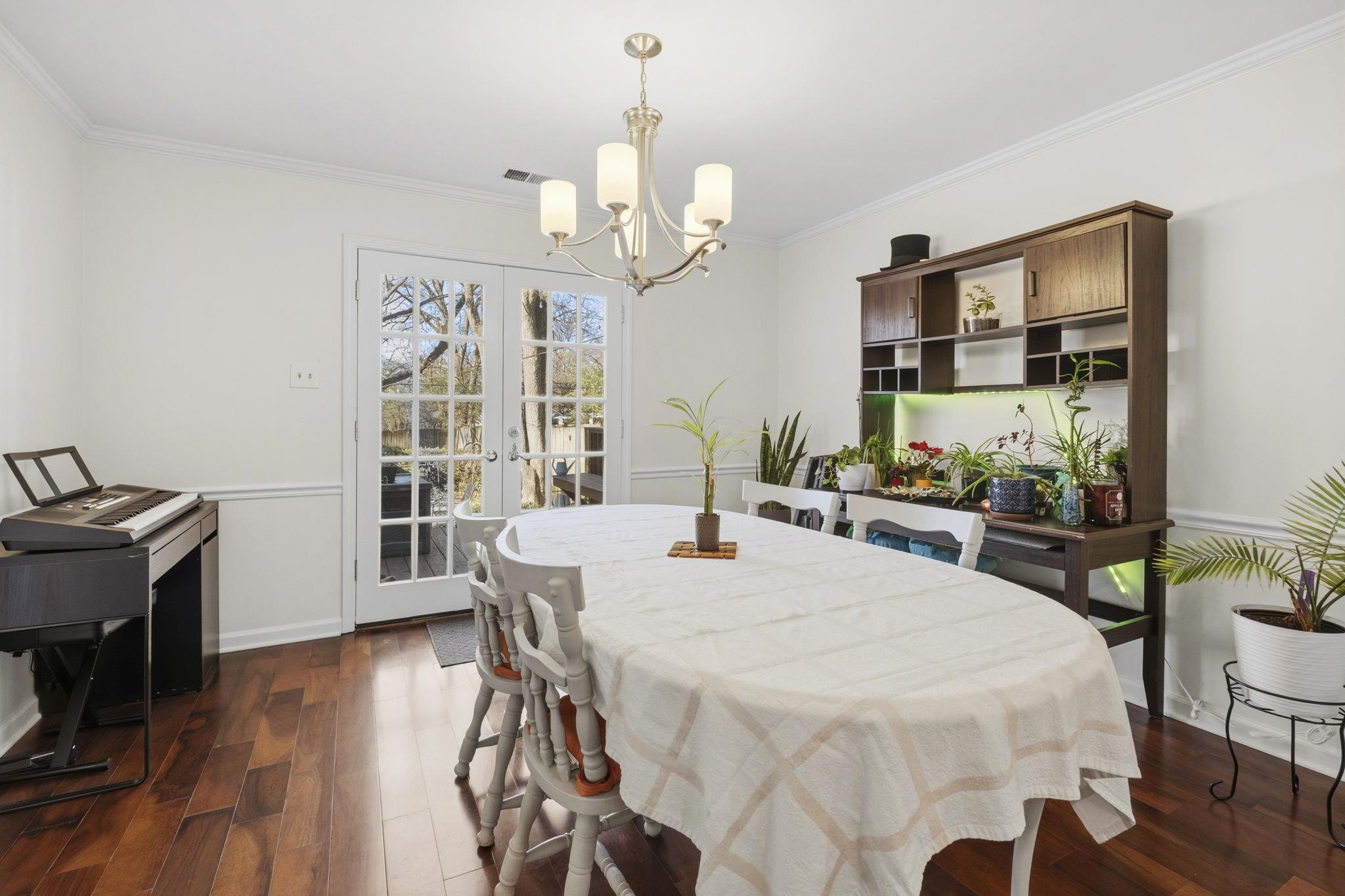 395 Alexander Street Memphis, TN 38111 - Photo 10 of 36 a view of a dining room with furniture window and wooden floor