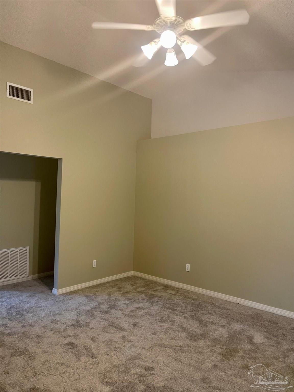 5162 Goshawk Drive Milton, FL 32570 - Photo 11 of 26 an empty room with a fan & a window