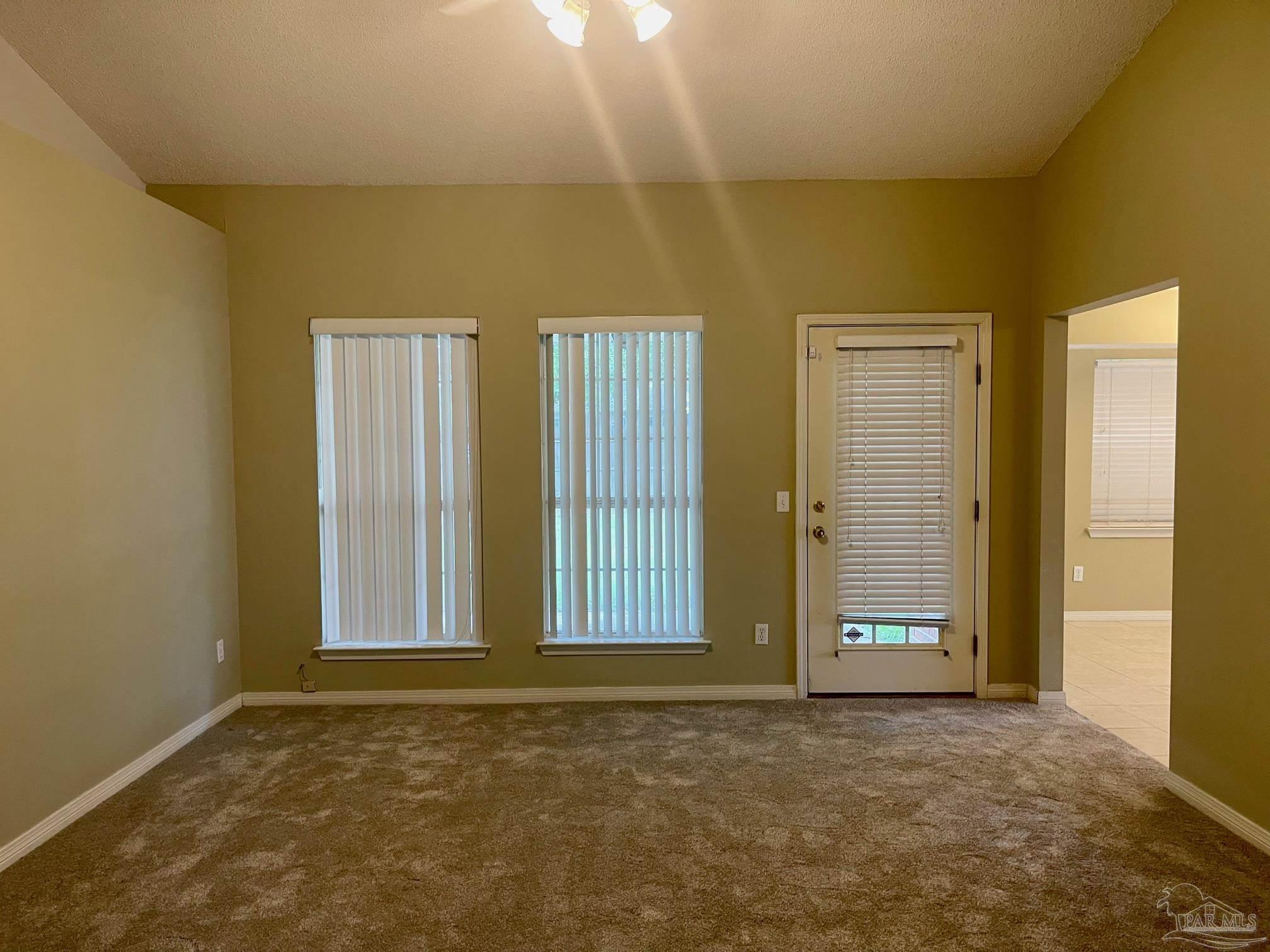 5162 Goshawk Drive Milton, FL 32570 - Photo 12 of 26 an empty room with windows