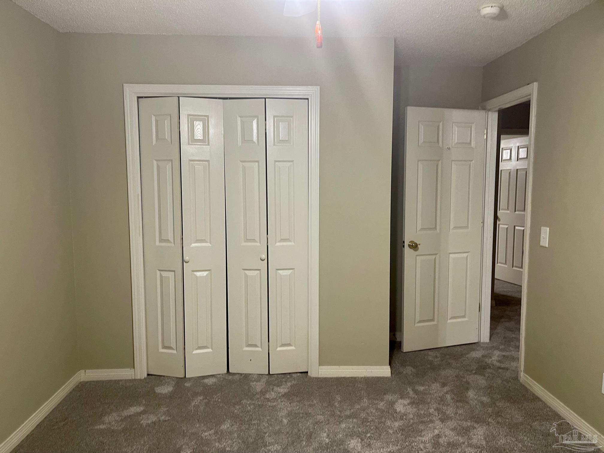 5162 Goshawk Drive Milton, FL 32570 - Photo 22 of 26 an empty room with closet area