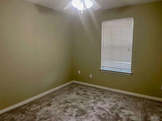 an empty room with closet area