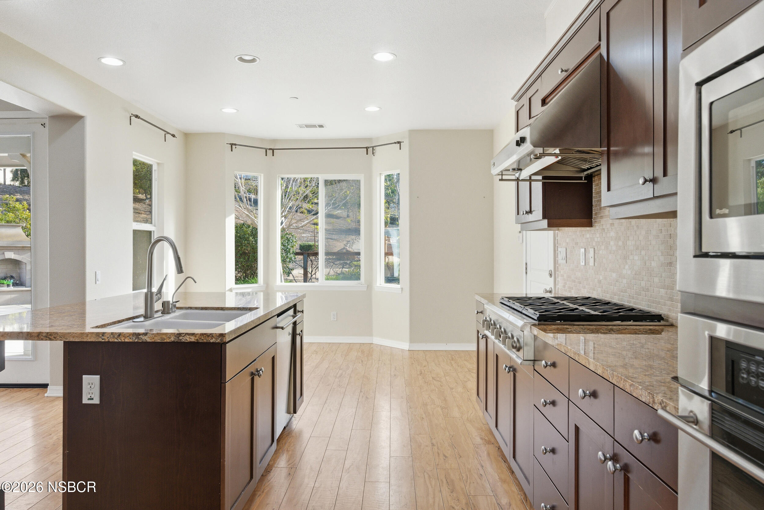 5632 Menemsha Lane Santa Maria, CA 93455 - Photo 7 of 66 a kitchen with stainless steel appliances granite countertop a stove and a sink