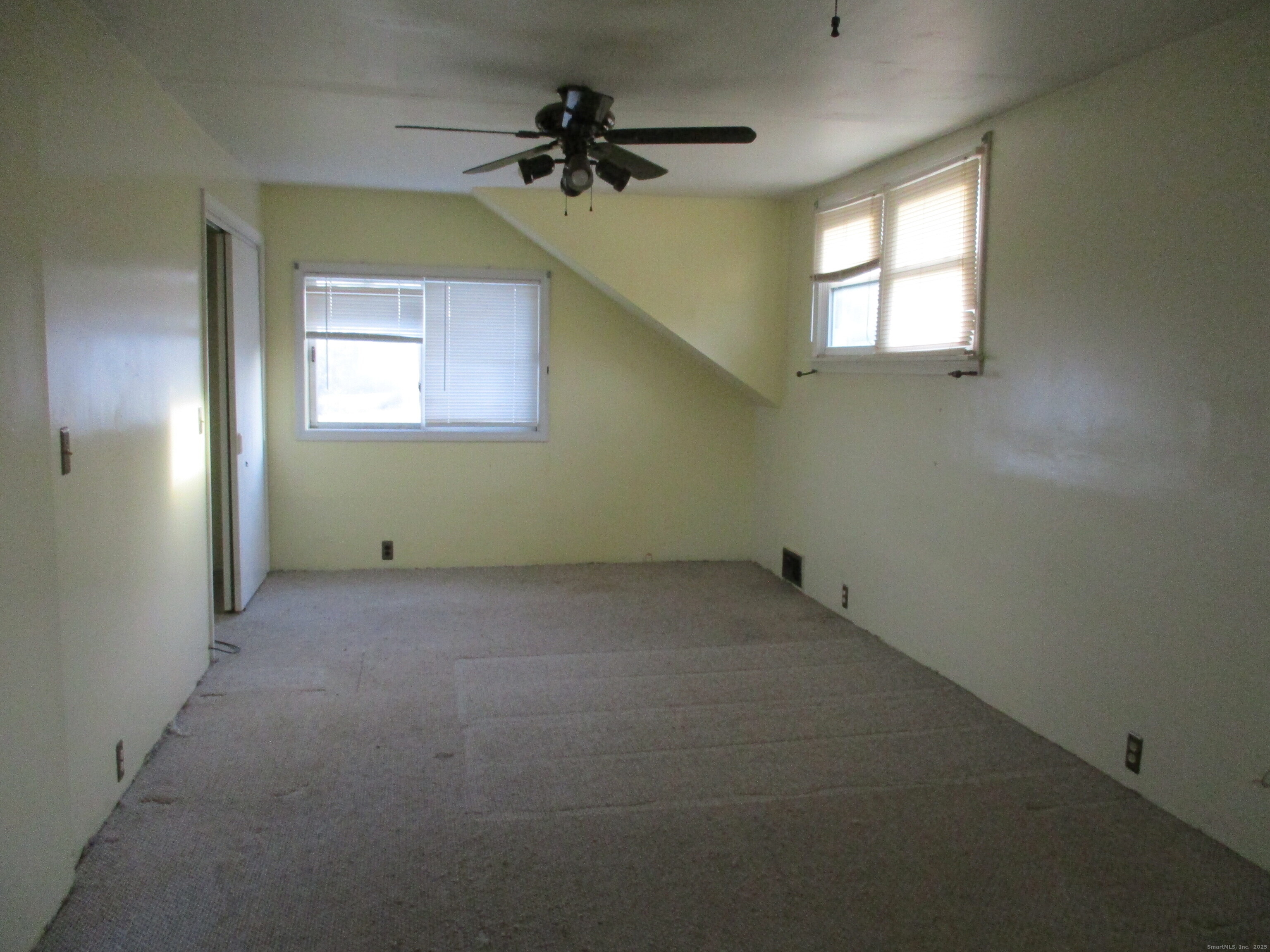 151 Brandy Hill Road Thompson, CT 06277 - Photo 13 of 36 an empty room with a window and a fan