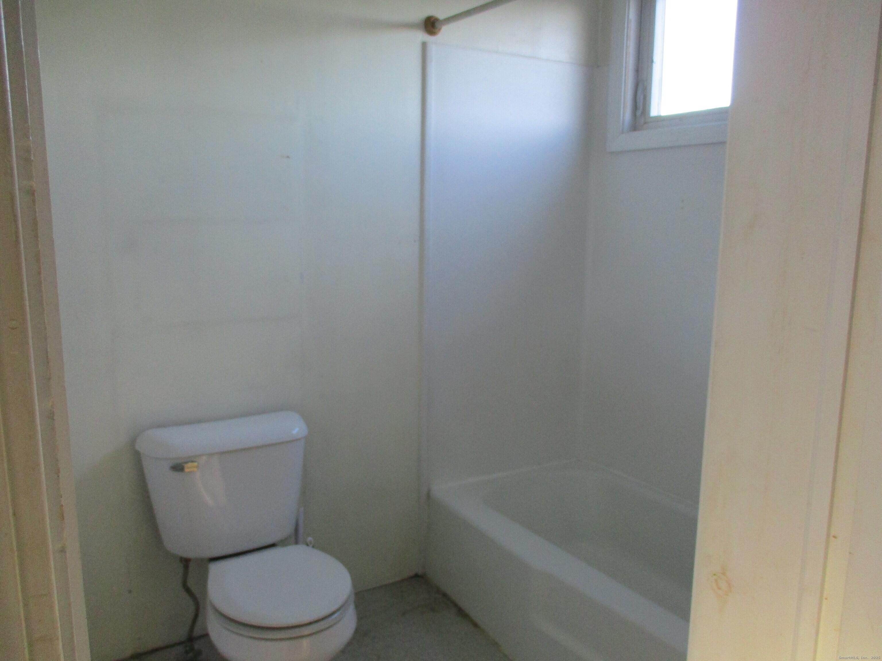 151 Brandy Hill Road Thompson, CT 06277 - Photo 19 of 36 a white toilet sitting next to a bath tub